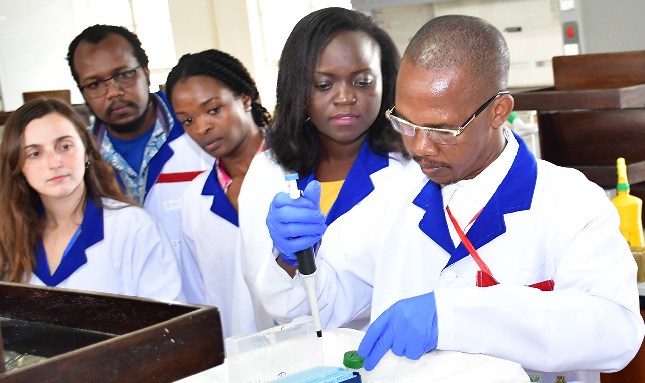 Research scientists in the laboratory using modern technology to develop enzymes for research work during enzyme manufacturing masterclass in Nairobi spearheaded by Kenyatta University and ISAAA AfriCenter