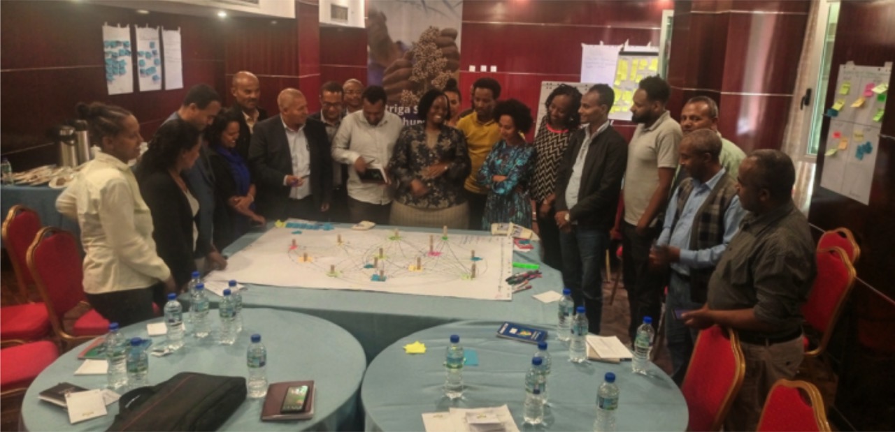 Stakeholder Netmapping exercise participants gathered around a mapping table